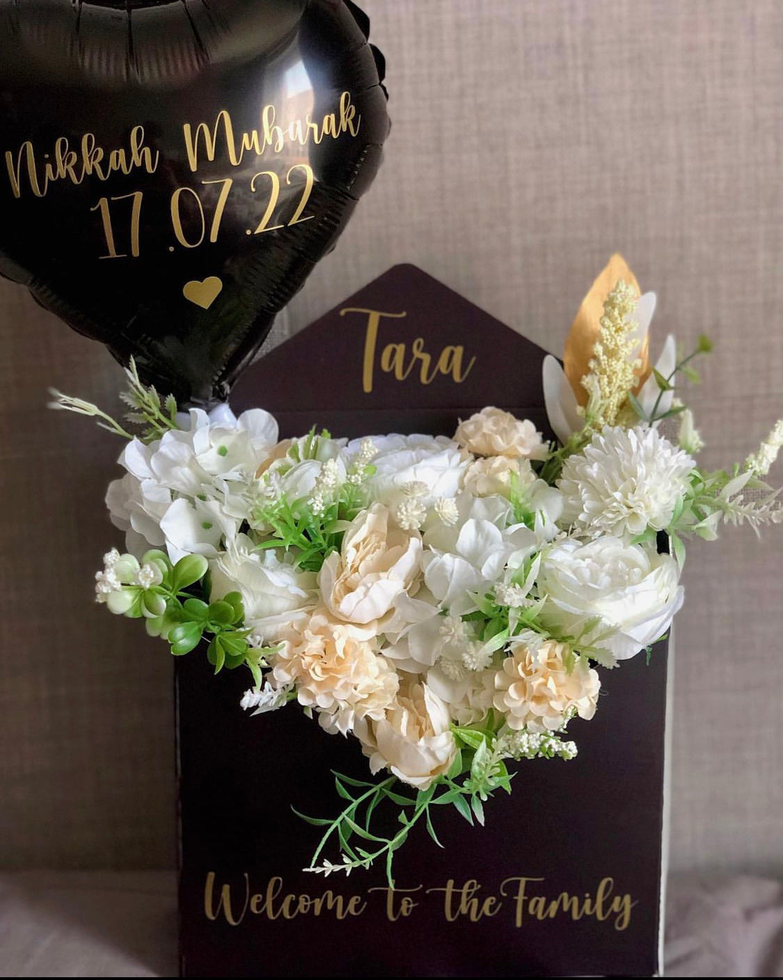 Envelope with flowers and balloon