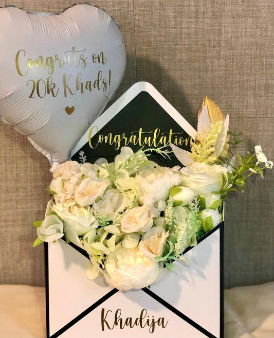 Envelope with flowers and balloon